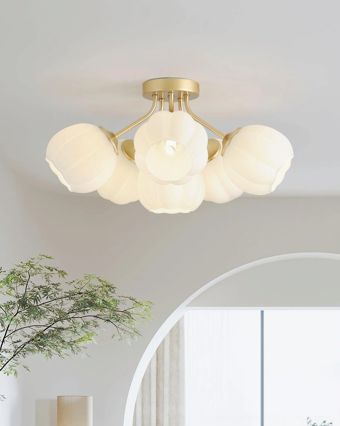 Marra floral ceiling light fixture showcasing modern botanical design with brushed gold hardware and frosted pumpkin glass