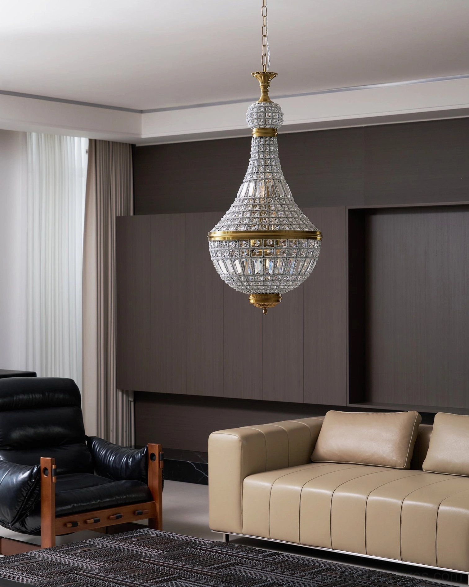 Marrakech silver crystal chandelier side hanging view dark wood wall neutral sofa