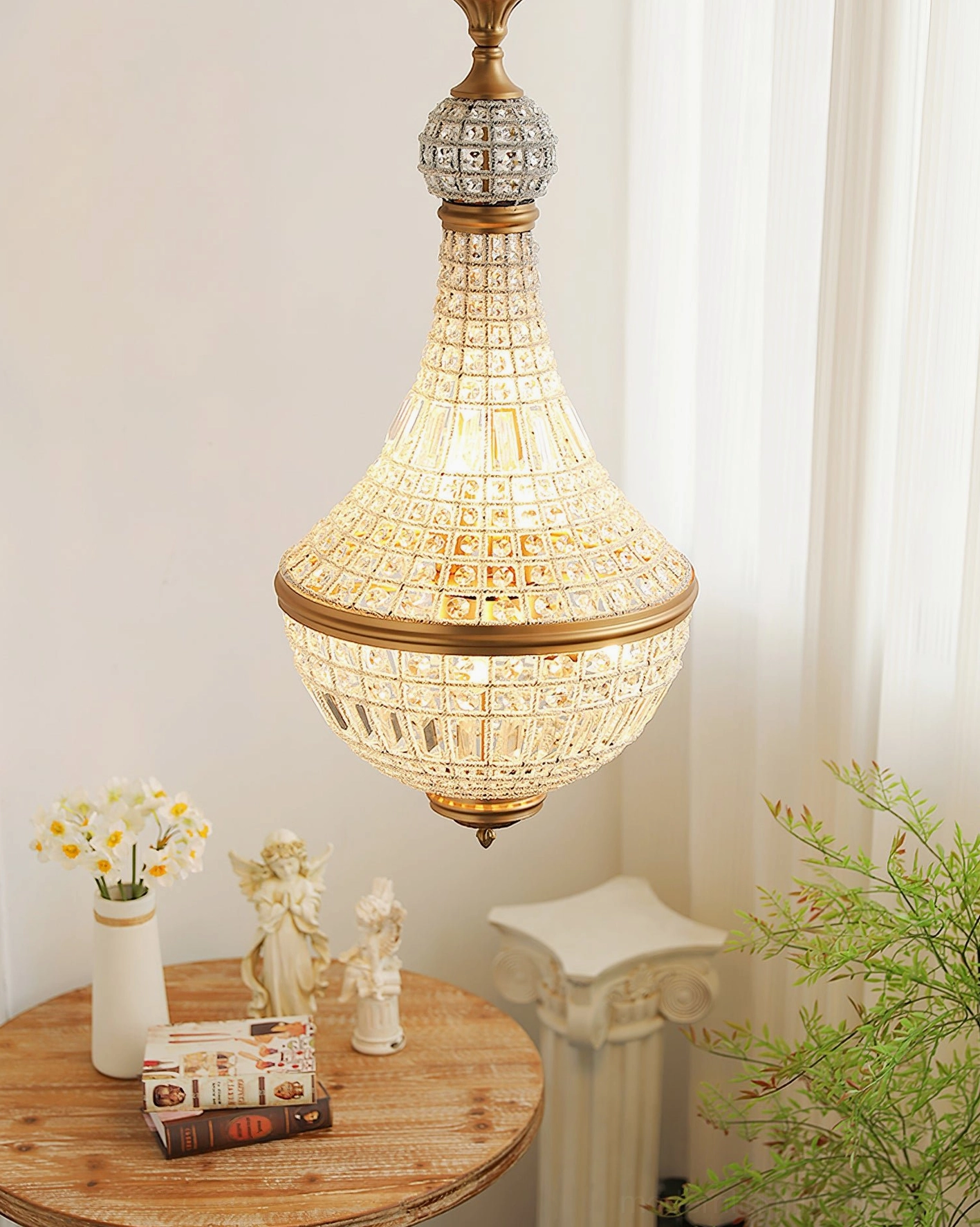 Marrakech gold crystal chandelier illuminated warm glow teardrop design full coverage