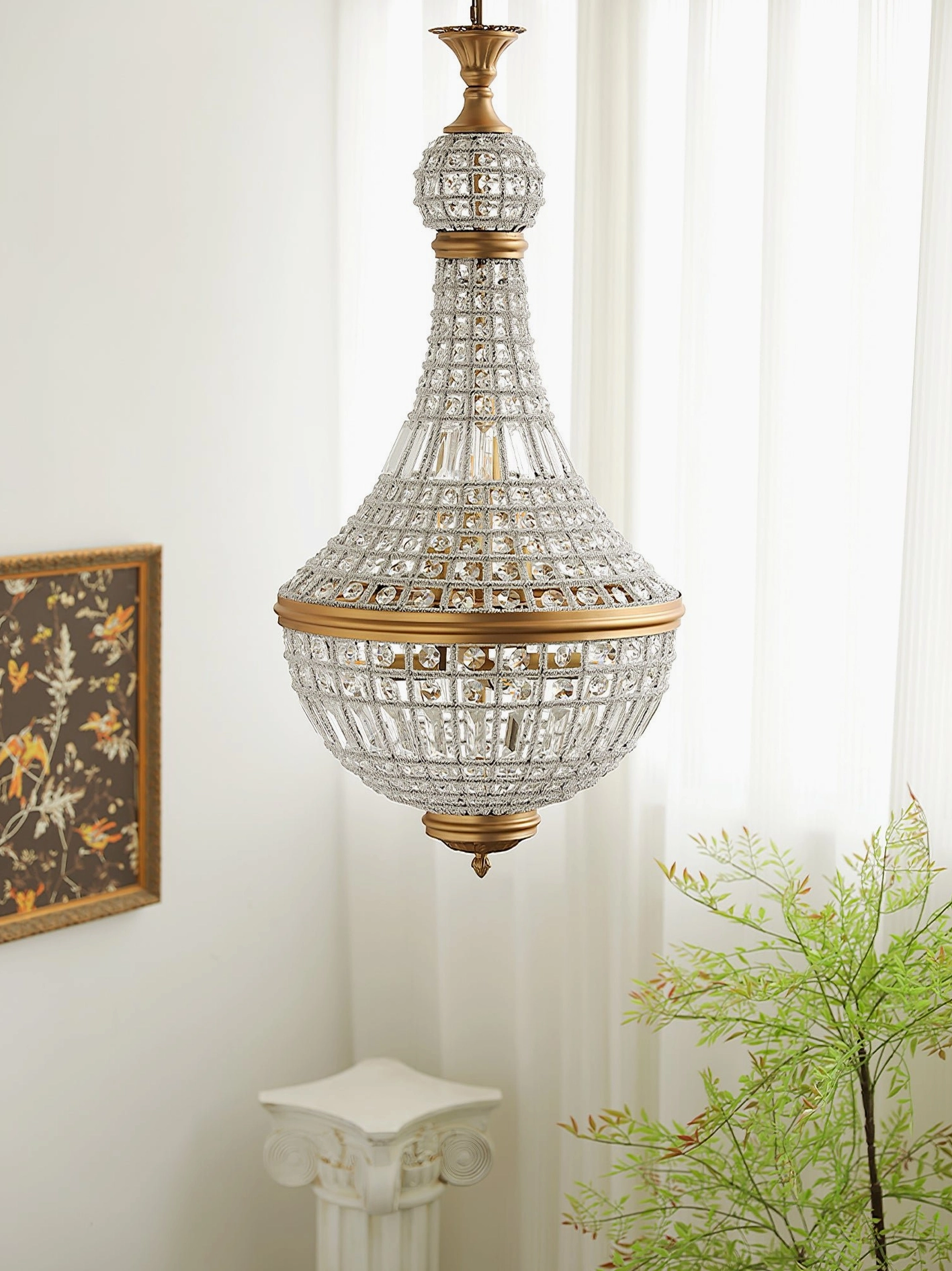 Marrakech gold crystal chandelier side view with natural light from sheer curtains