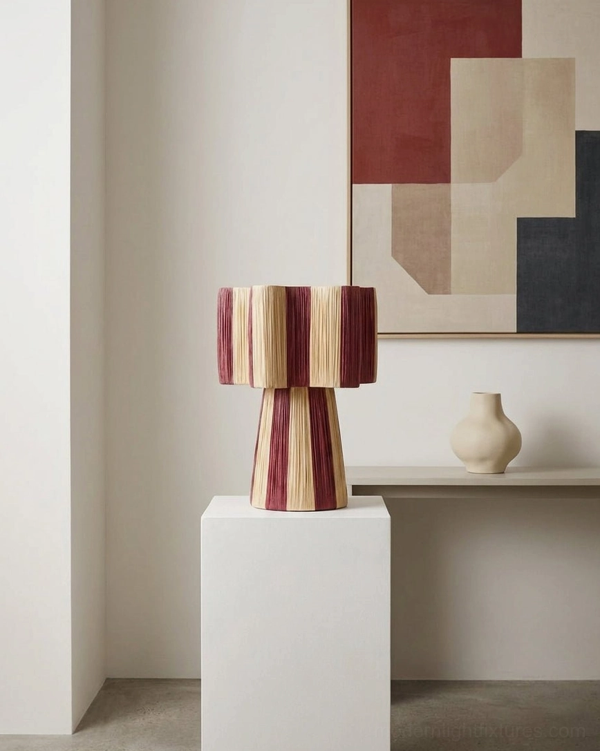 Maruvia cotton-cord table lamp base close-up showing tapered hourglass shape and burgundy cream stripe detail