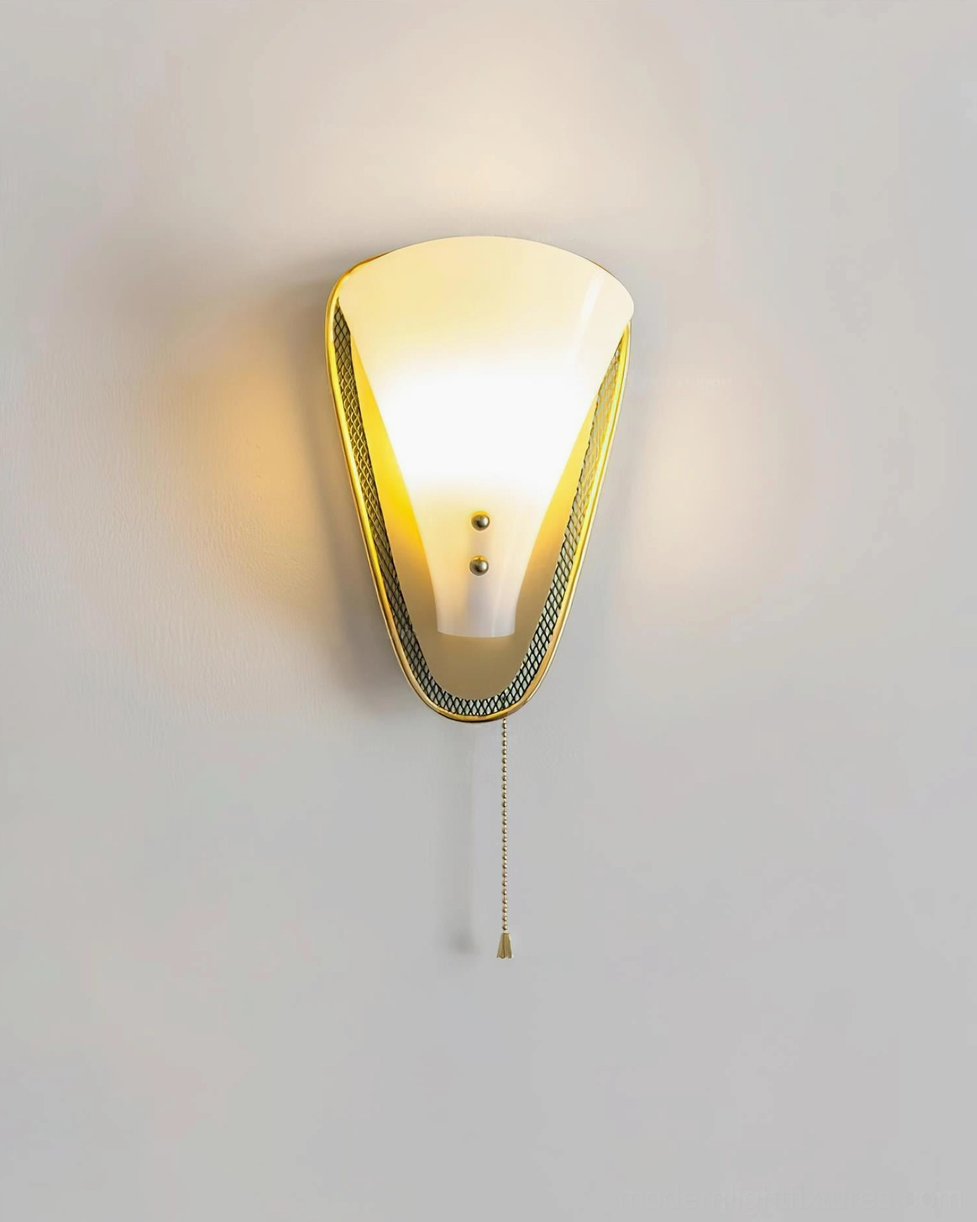 Marzio mid-century wall sconce illuminated front view showing warm white LED and mesh-edged brass trim
