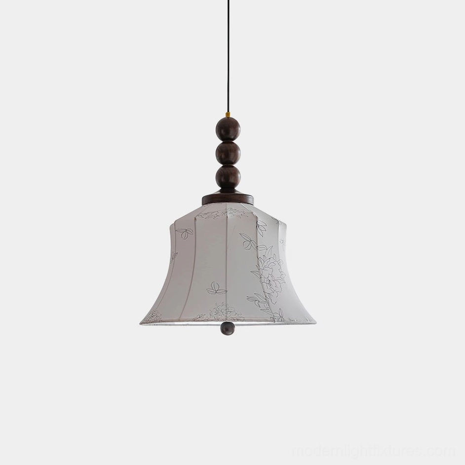 Materia fabric pendant light with walnut beaded stem and cream bell shade, front view on white background