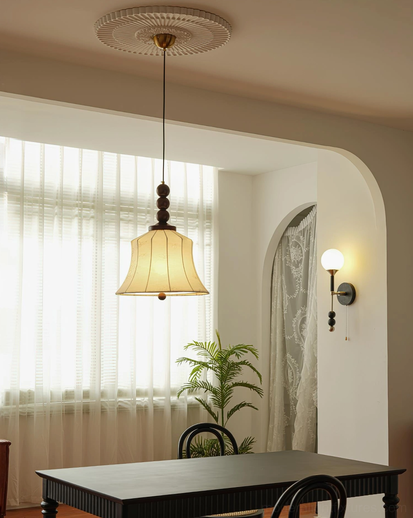 Materia fabric pendant lamp in minimalist dining space with arched doorway and contemporary furnishings