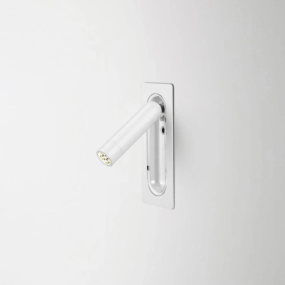 Matt white finish recessed wall reading lamp installed in contemporary bedroom with warm 3000K light output