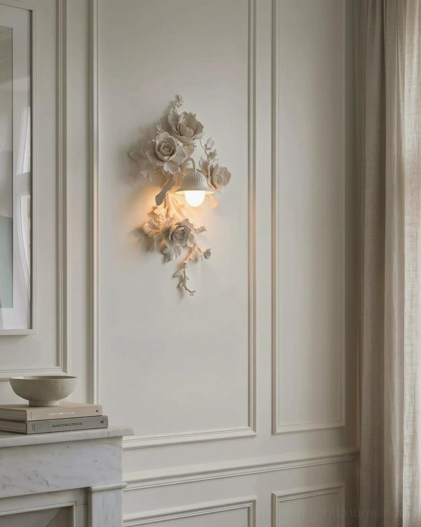 Off-white matte Elysia Bloom floral wall sconce in wainscoting interior, accent downward lantern lighting soft warm glow