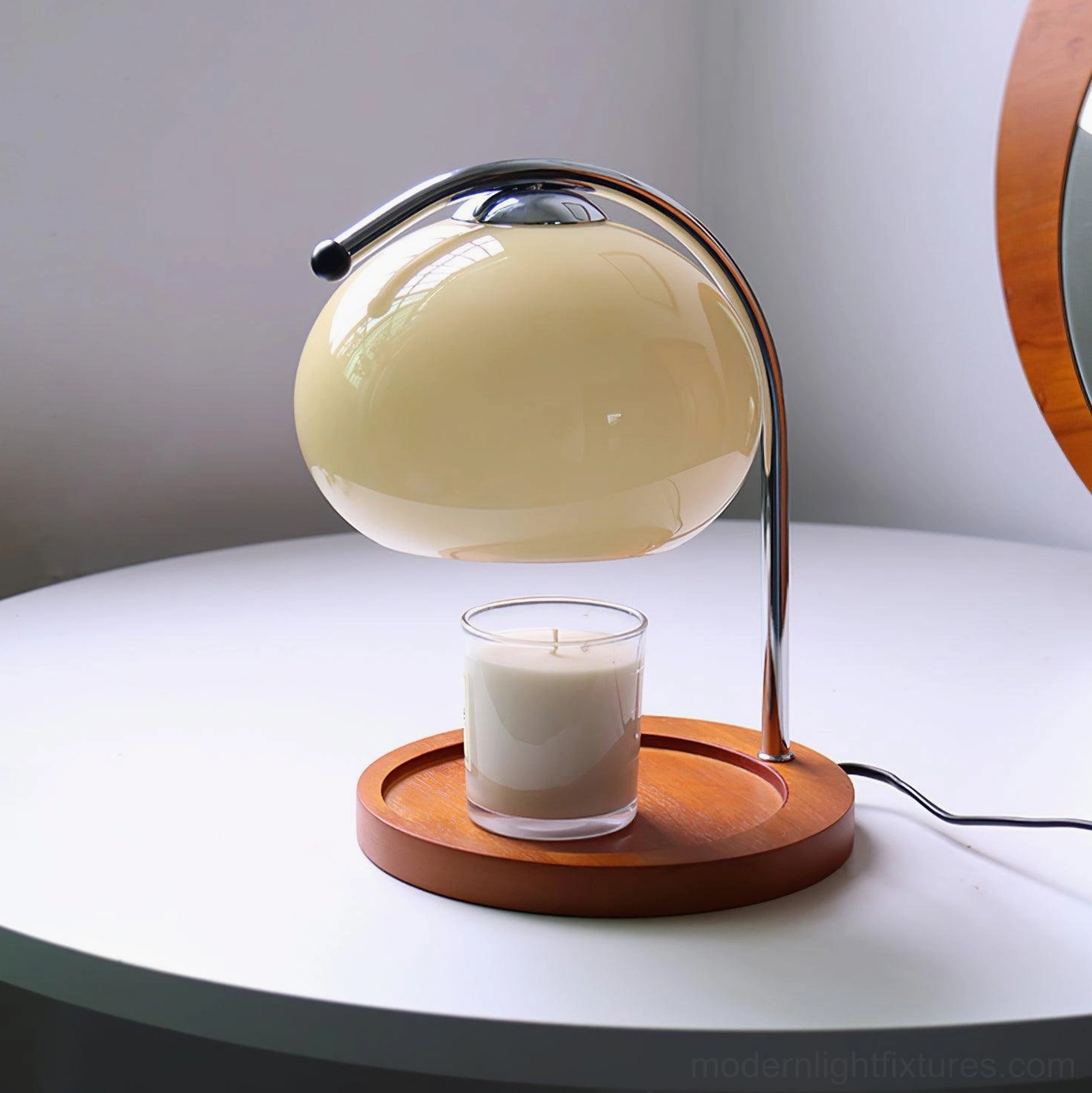 Mauri halogen candle warmer lamp with cream beige shade and chrome metal frame on white round table