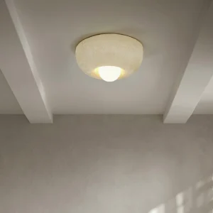 Modern minimalist Mauro ceiling fixture installed on exposed beam ceiling in contemporary home interior