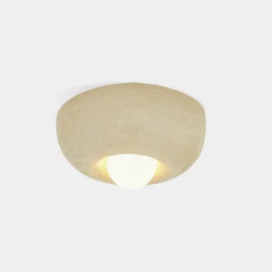 Mauro minimalist ceiling light with beige textured bowl-shaped design and warm embedded downlight in studio setting