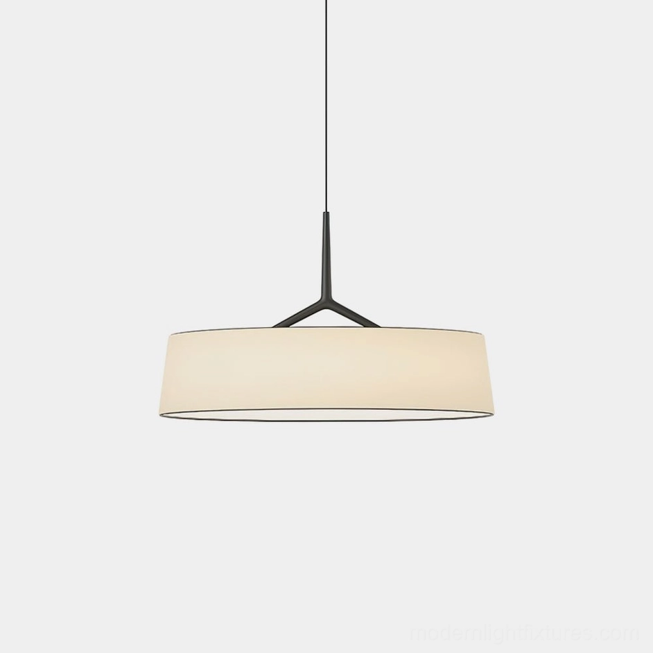 Maxim modern pendant light with white fabric drum shade and black metal frame, front studio view