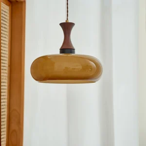 Mayon pendant light side profile showing antique brown glass shade and wooden metal hardware on interior