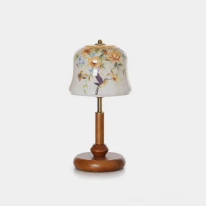 Meadow hand-painted floral hummingbird table lamp with walnut wood base and brass accents, front view on white background