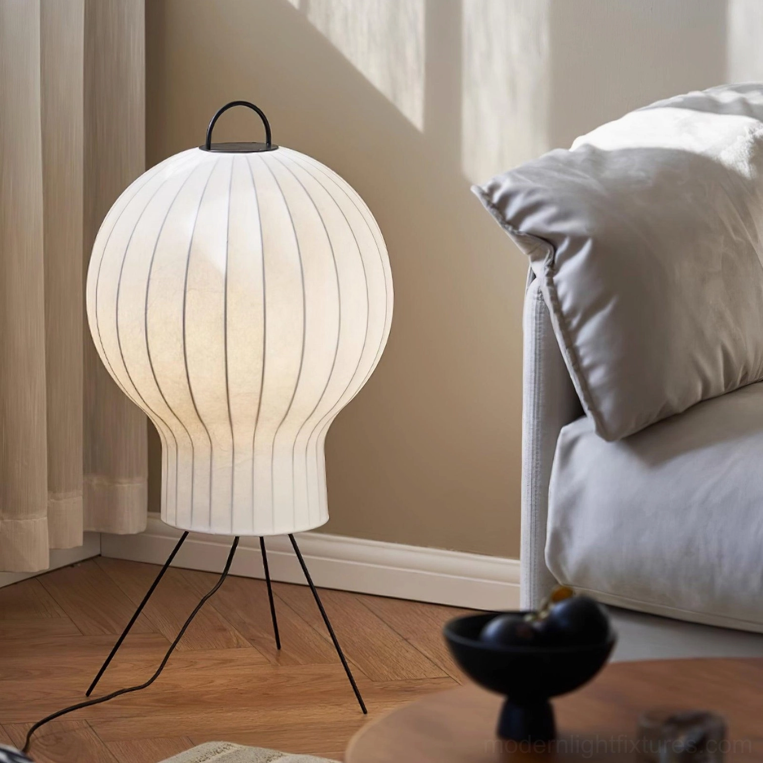 Three-quarter view of medieval silk floor lamp in contemporary master bedroom setting