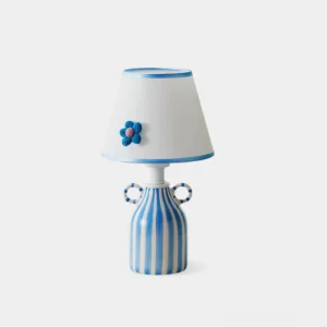Mediterranean ceramic blue and white striped table lamp with handcrafted felt flower shade - close-up front view