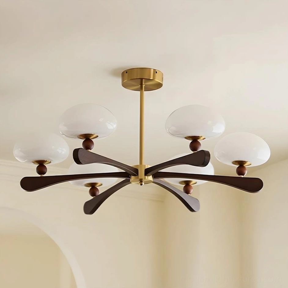Medium 6-light mid-century modern radial chandelier with dark walnut wood arms, warm gold-tone center, and opal-white glass domes—versatile size