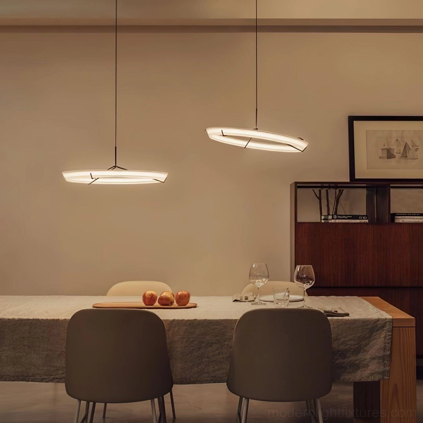Medium round pendant lamp in brass gold with warm LED light in modern home interior