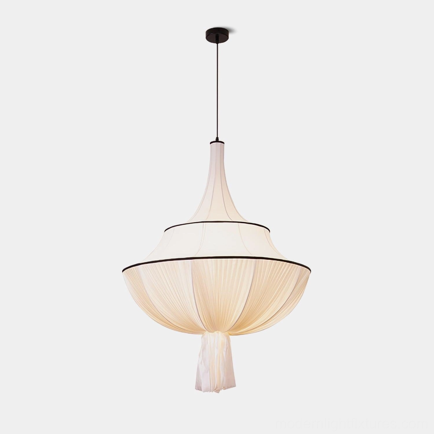 Meduse pleated fabric pendant light, off-white tiered shade with black trim and tassel detail, front studio view