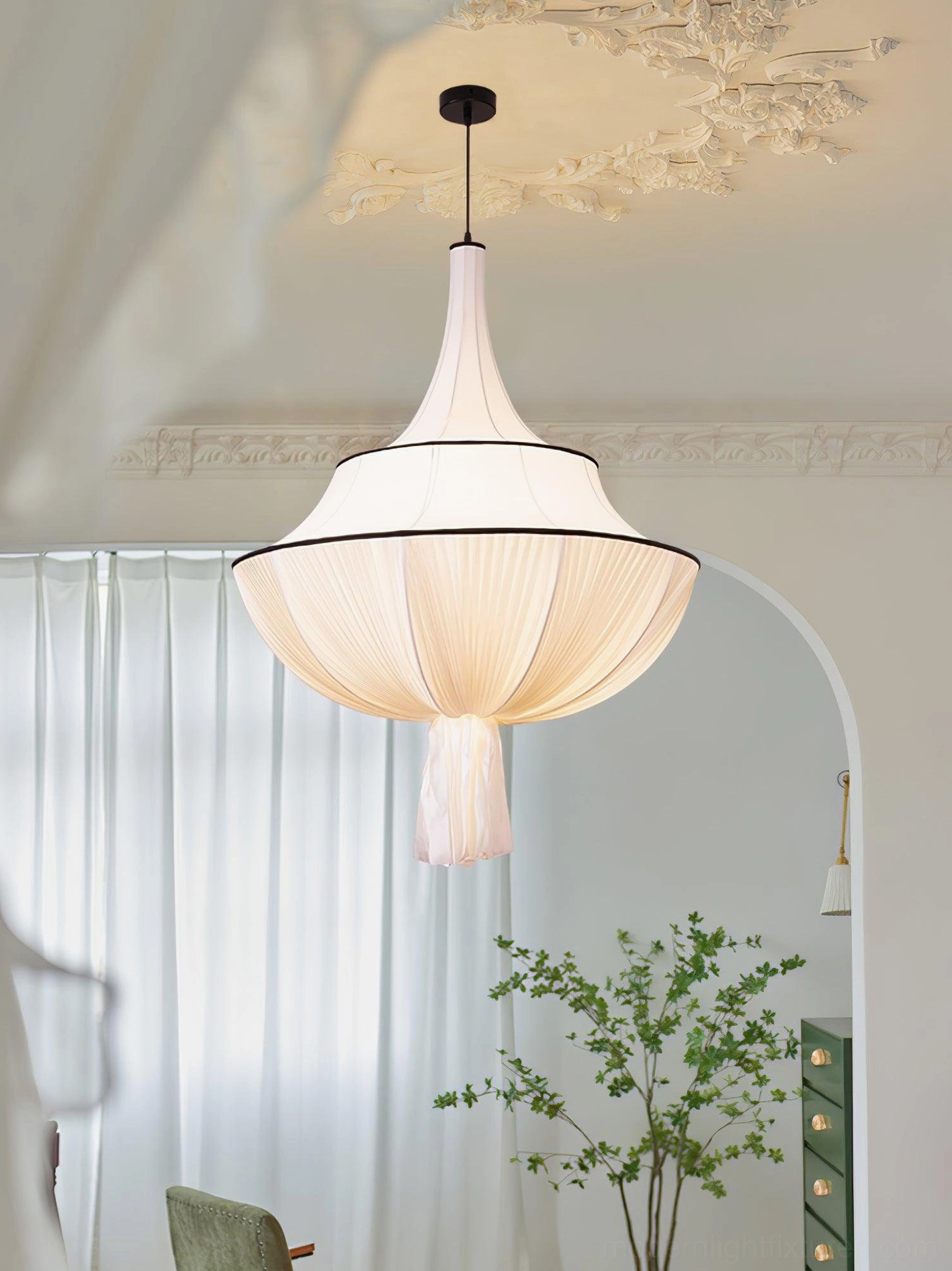 Fabric pendant light fixture with black trim and tassel detail, versatile bohemian-modern design