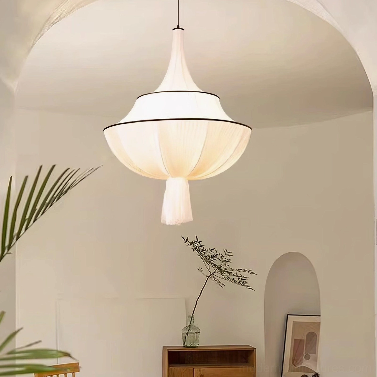 Tiered fabric pendant lamp with black trim above wooden cabinet, contemporary neutral home lighting