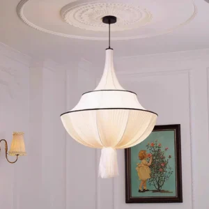 Modern fabric pendant lamp in French-style living room with plaster ceiling, warm bohemian ambient lighting