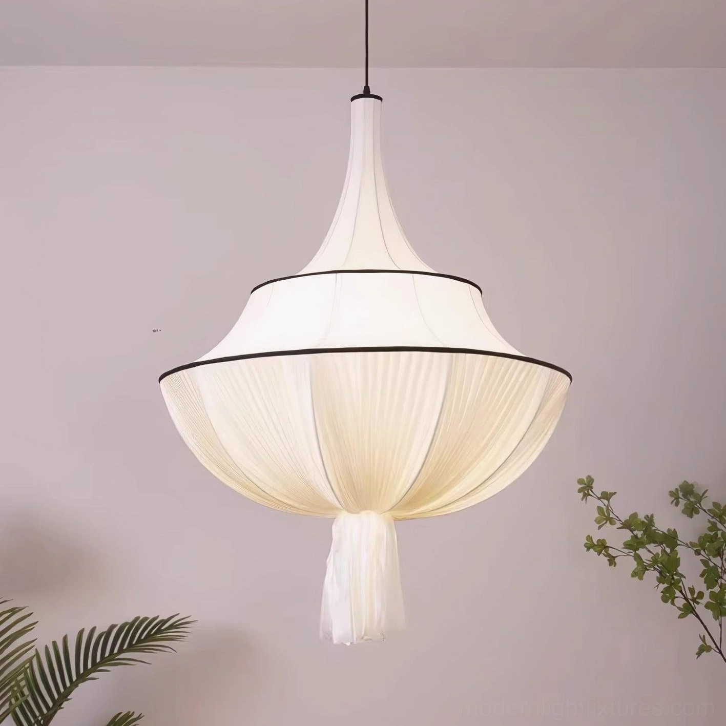Meduse pleated pendant light, sculptural fabric shade creating warm diffused illumination