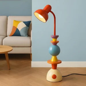 Mello geometric art floor lamp in modern living room three-quarter view next to beige sofa, colorful sphere and cone design with warm lighting ambiance