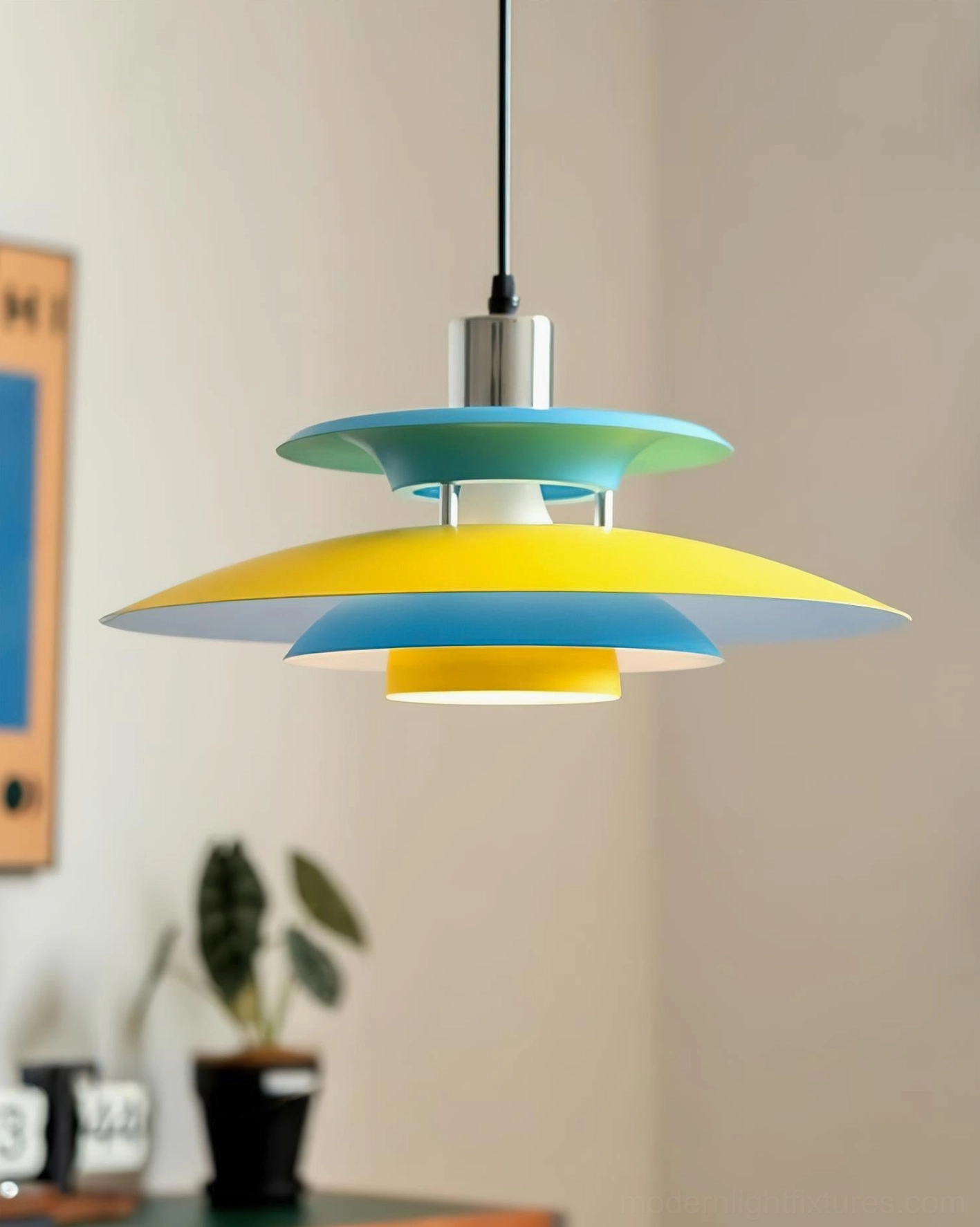 Mellowe geometric pendant light in dining corner with potted plant and wall décor, complementary color scheme