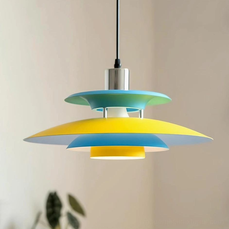 Three-quarter view of Mellowe pendant lamp showing layered yellow and cyan aluminum disc structure with chrome ceiling mount hardware