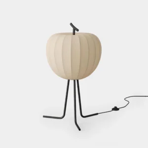 Melora modern floor lamp front view with sculptural ribbed fabric shade and matte black tripod base on white studio backdrop