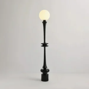 Black modern floor lamp with frosted glass sphere and glossy black pole, detailed close-up