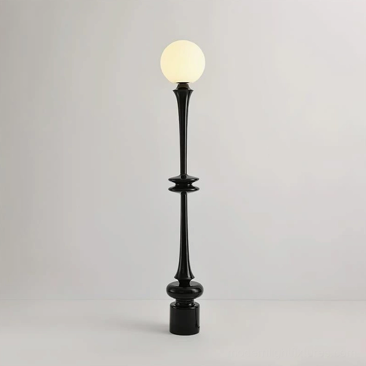 Black modern floor lamp with frosted glass sphere and glossy black pole, detailed close-up