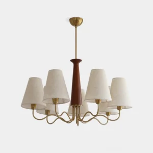 Melvyn mid-century modern chandelier with brass metal arms, walnut wooden core, and beige fabric shades - studio front view