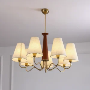 Six-light Melvyn chandelier with curved metal suspension rod and soft fabric lamp shades - close-up interior shot
