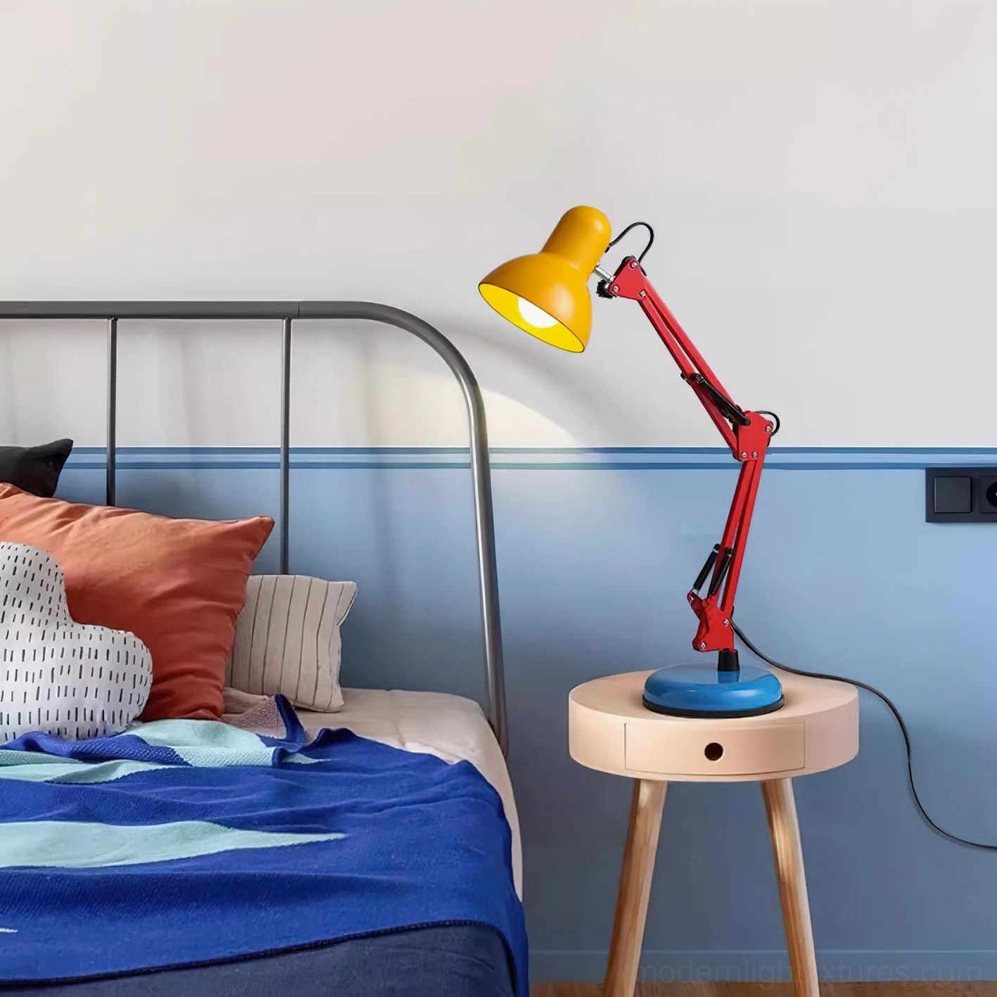 Memphis-style desk lamp glowing with warm light - modern postmodern table lamp illuminated at night for ambient reading and workspace lighting