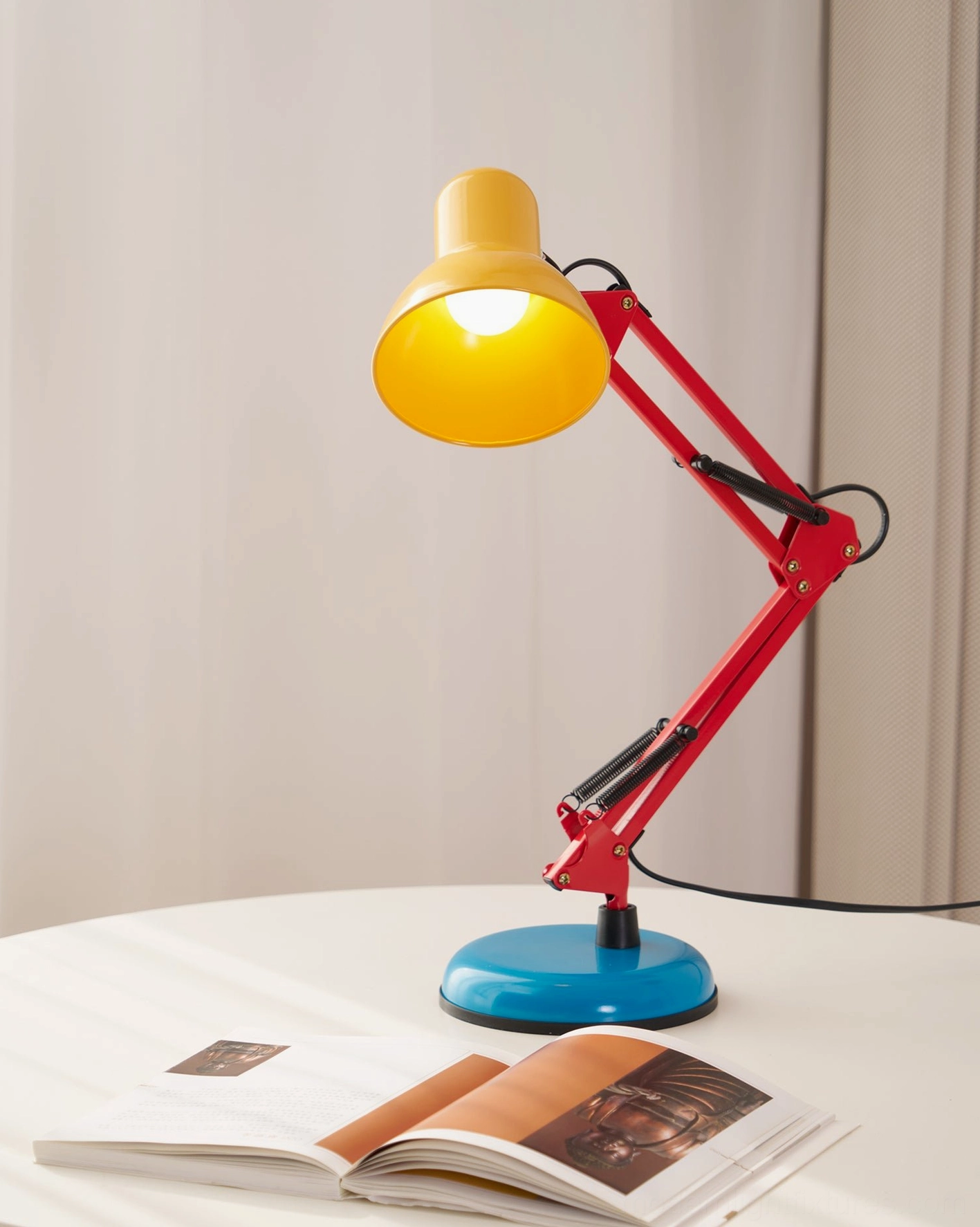 Memphis desk lamp positioned overhead view - compact 35cm width footprint showing space-saving design for small desks and side tables