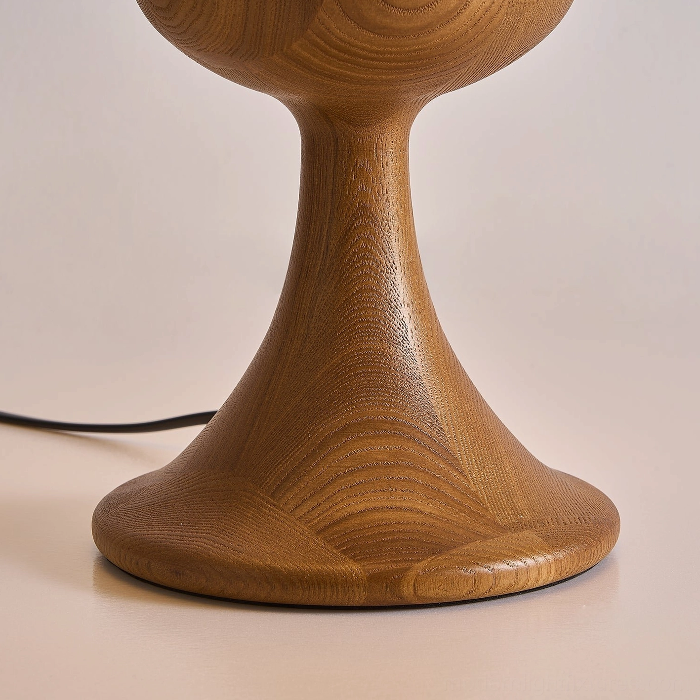Mensy modern table lamp in contemporary living room setting with sculptural base and luminous dome shade creating ambient lighting