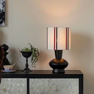 Meridian Band mid-century modern table lamp displayed on vintage home cabinet in retro interior setting