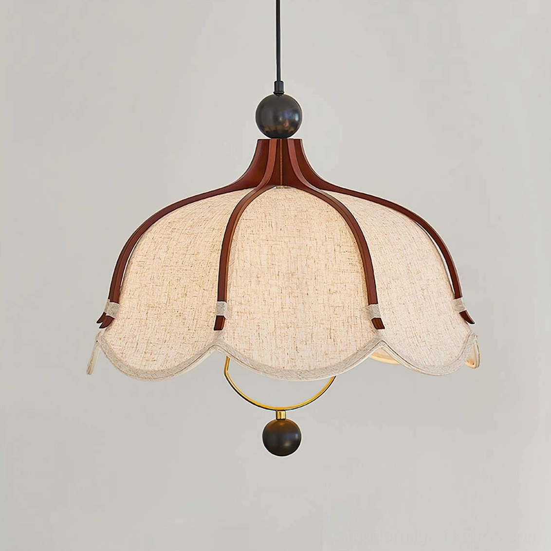 Meringa pendant light showing brass ring detail under scalloped fabric shade, walnut wood frame detail