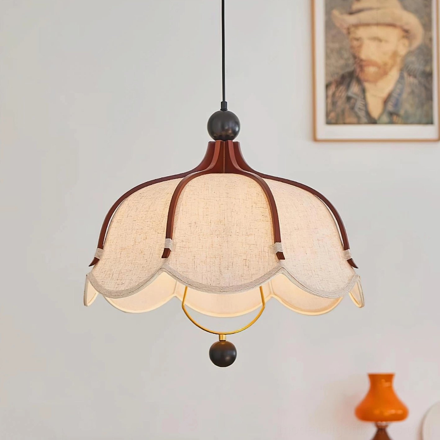 Meringa vintage pendant light hanging in retro residential interior above table with Van Gogh wall art