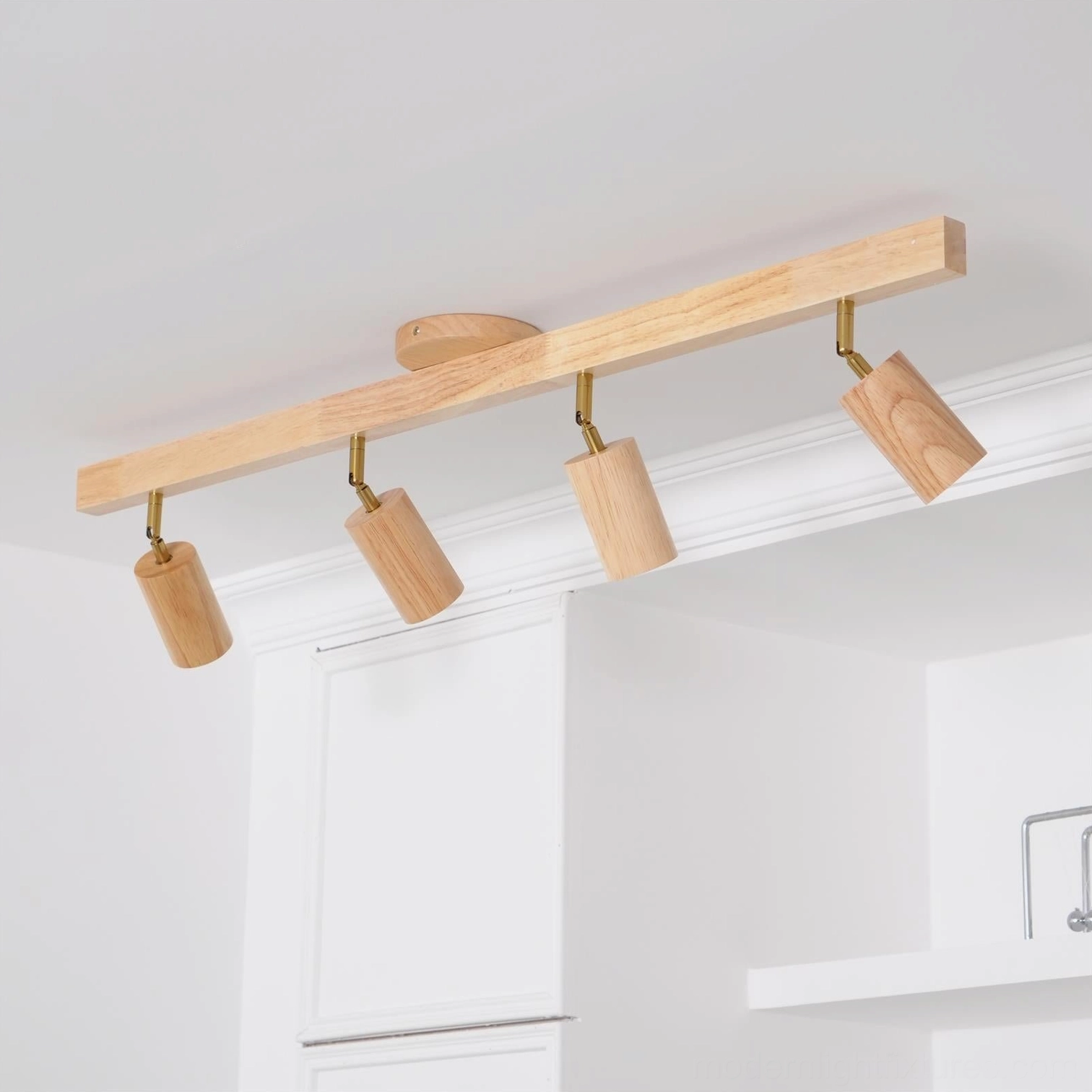 Natural wood track light ceiling fixture installed in contemporary living space