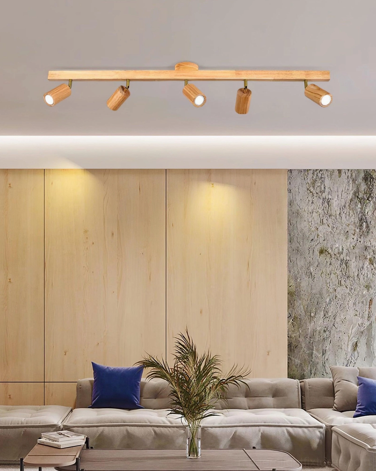 Wooden track light fixture installed on feature wall for gallery and artwork lighting