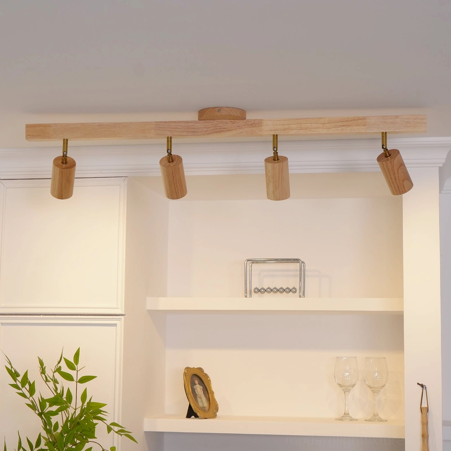 Multiple wooden track light fixtures arranged for larger space lighting design