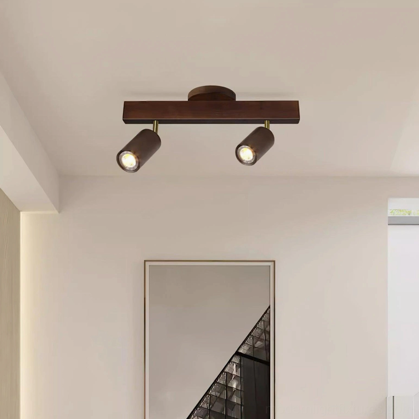 Warm wooden track lighting in open plan kitchen and dining area