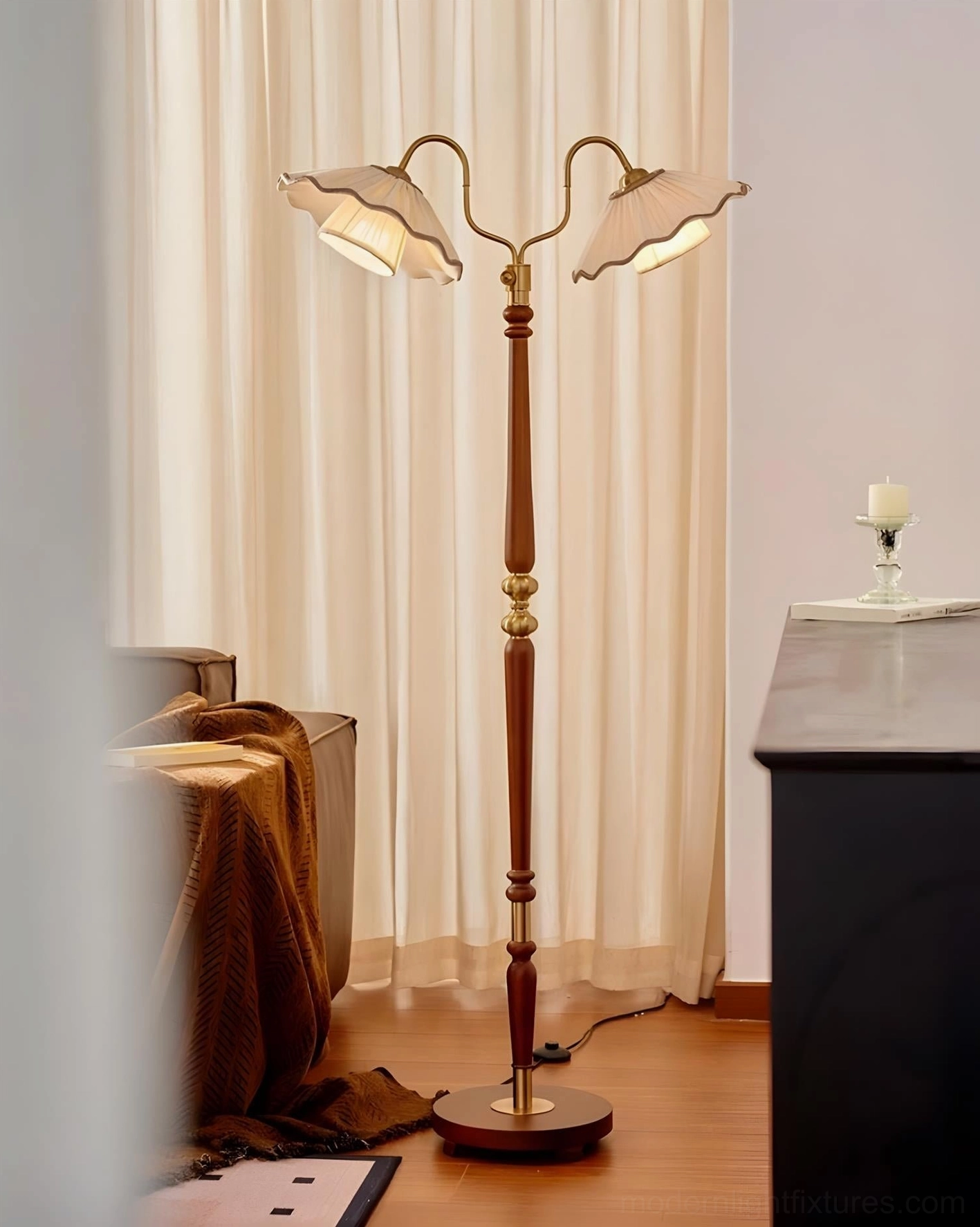 Side view of Merritt two-light floor lamp in curtained corner with small side table, minimalist neutral vintage home decor aesthetic