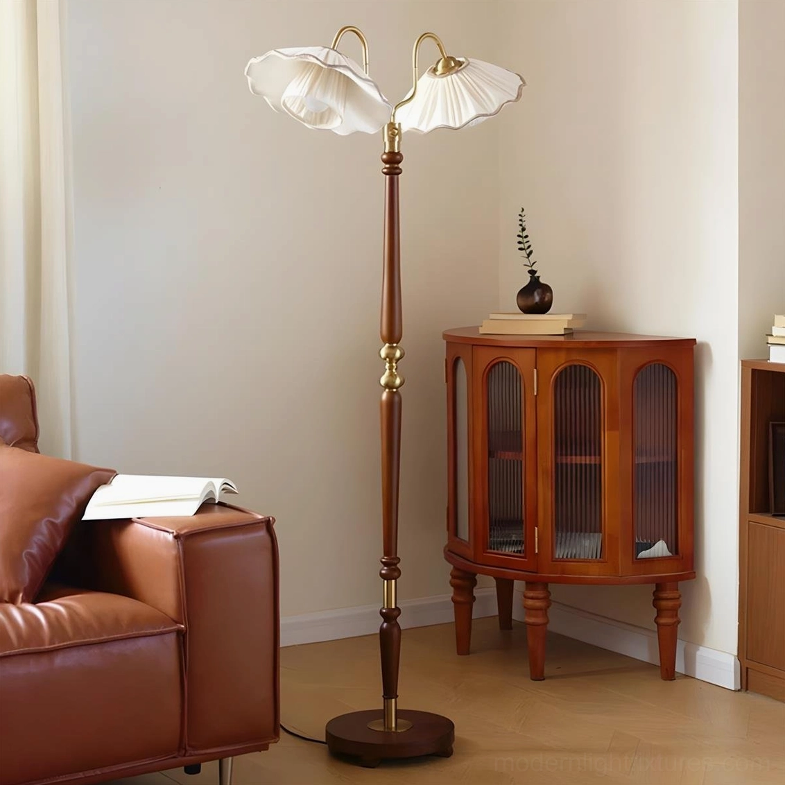 Merritt vintage floor lamp with ruffled pleated shades positioned beside leather sofa and wooden display cabinet, mid-century retro style