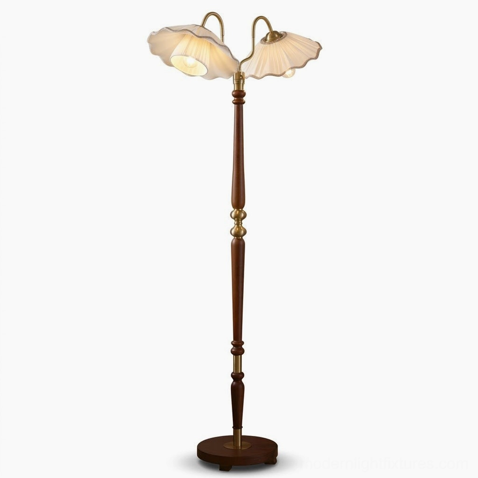 Merritt floor lamp with dual pleated fabric shades, turned walnut finish oak stem with brass ring accents, and round wooden base with brass center
