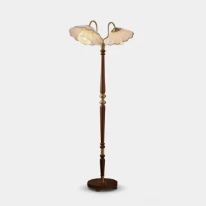 Merritt two-light floor lamp with pleated fabric shades, turned walnut oak stem, and brass gooseneck arms, full frontal view on white background
