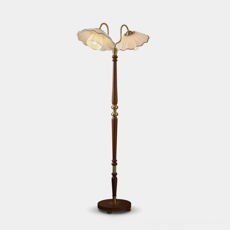 Merritt two-light floor lamp with pleated fabric shades, turned walnut oak stem, and brass gooseneck arms, full frontal view on white background