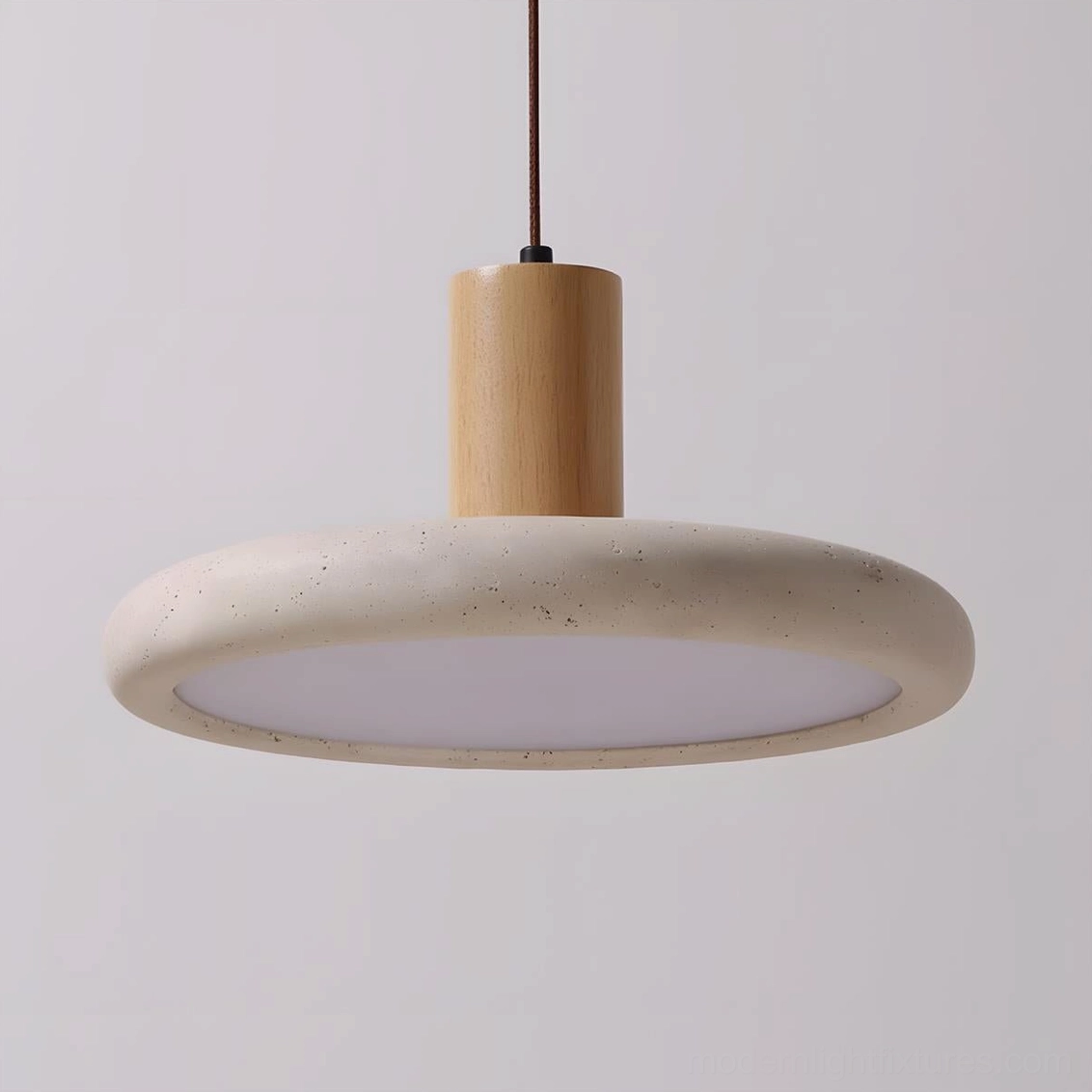 Large Mesa Halo travertine pendant light installation in contemporary minimalist interior space with clean architectural lines