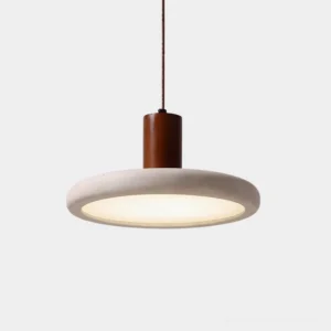 Mesa Halo modern travertine pendant light with natural wood cylinder top, close-up front view showing warm internal LED glow